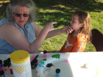 Anna Wright of Milton, Massachusetts receives a face painting during Family Harvest Days . BILL PEARSON/Boothbay Register