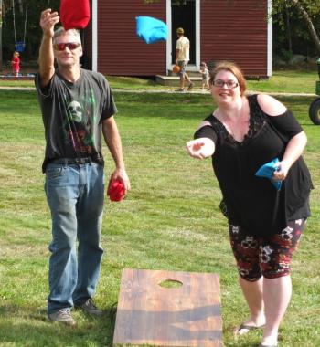 Leo Barter Jr. and Katrina Pearce play cornhole during Family Harvest Days. BILL PEARSON/Boothbay Register