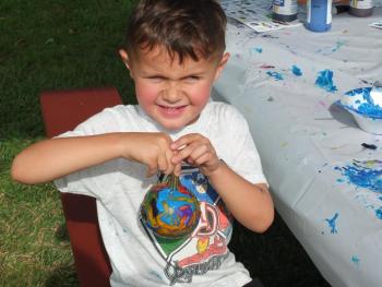 James Ortiz displays his painted mini-pumpkin Sept. 22 at Family Harvest Days. BILL PEARSON/Boothbay Register