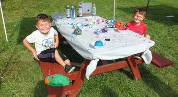 James Ortiz and Oscar Ortiz take a break from pumpkin painting to say “cheese” for a photo. BILL PEARSON/Boothbay Register