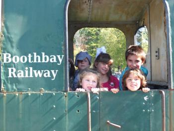 Family Harvest Days had lots of games and rides, but these kids loved checking out a train car Sept. 21 at Boothbay Railway Village. BILL PEARSON/Boothbay Register