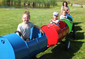 The barrel ride was a popular event during Family Harvest Days at Boothbay Railway Village. From left, Catalia Curtis and Jacob and Joshua Bilodeau go for a ride Sept. 21. BILL PEARSON/Boothbay Register