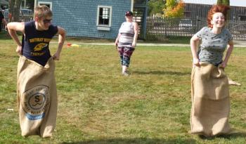 Damien Torre challenged Courtney Leckie-Usinger to a sack race Sept. 22 during Family Harvest Days. BILL PEARSON/Boothbay Register