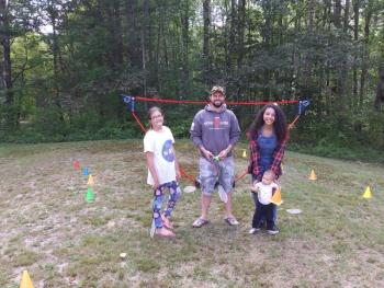 Members of the Sherlock family stand by for badminton. From left are Bella, Joe, Imij Armstead and toddler Maya. JANE CARPENTER/ Boothbay Register
