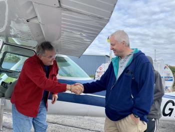 Clifford Dow, right, of New Gloucester greets the next pilot to arrive at Wiscasset Municipal Airport Oct. 11, Bangor’s Bob Ericson. SUSAN JOHNS/Wiscasset Newspaper