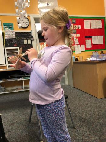 Aurora Wallace inspects her assembled catapult. JENNY BENNETT/Boothbay Register