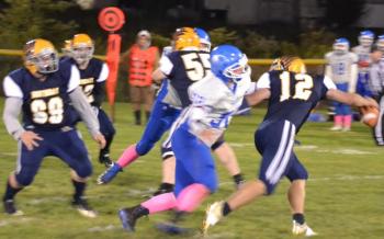 Boothbay quarterback Hunter Crocker avoids the rush Oct. 4 in the Seahawks’ 36-0 homecoming victory over Sacopee Valley. BILL PEARSON/Boothbay Register