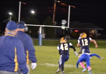 Boothbay quarterback Hunter Crocker scampered 50 yards for a first quarter touchdown Oct. 4 in his team’s 36-0 homecoming game. BILL PEARSON/Boothbay Register