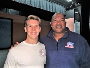 Hunter Crocker, a captain on the Boothbay Region High School football team, learns about becoming a youth mentor from former New England Patriots football player Garin Veris. Courtesy of BBBSMM