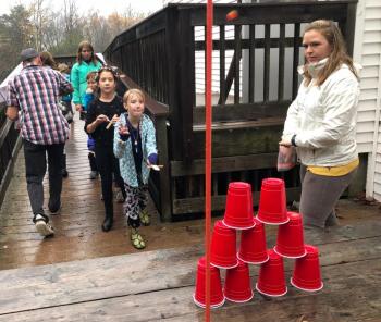 Stella Stevens goes for glory at the Tower Topple, one of six challenges at the Pumpkin Catapult Olympic Games. JENNY BENNETT/Boothbay Register