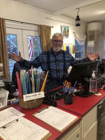 Mike Elkins, happy behind his new counter! JENNY BENNETT/Boothbay Register