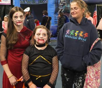 Hundreds of kids had a great time during Trunk or Treat, to the chagrin of a couple Grim Reapers. From left are Alyssa Morton, Ellie Morton and mother Sherri Morton. BILL PEARSON/Boothbay Register