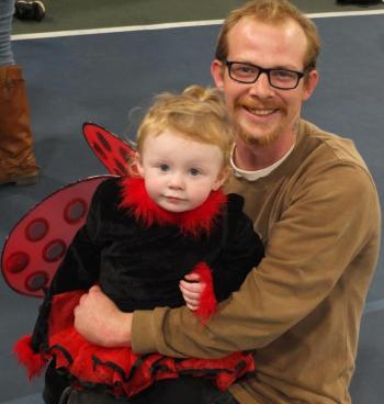 John Ellsworth holds his little butterfly, Justice Ellsworth, during Trunk or Treat. BILL PEARSON/Boothbay Register