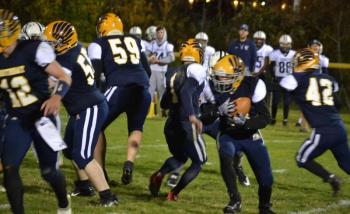 Boothbay tries a little razzle dazzle Oct. 11 by running a first quarter reverse in its 50-20 loss to Yarmouth. BILL PEARSON/Boothbay Register