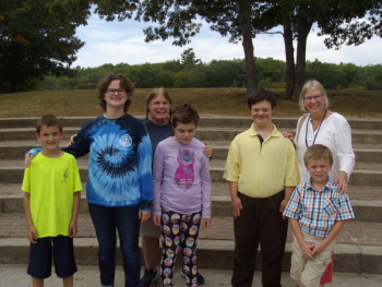 From left, Matthew Cusamano, Valerie Giles, Toby LeConte, Izabelle Hamlin, John“Piper’s Son” Rankin, and Coyle Lawler receive checks from Pam Baldwin of All Saints by-the-Sea. Courtesy photo
