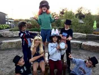 The Mad Hatter's Tea Party. Pictured from left are, front: Ford Harris (Party Guest/Dodo Bird), Anna Tomasello (Alice), Laura Tomasello (White Rabbit), Rebecca Tomasello (Matilda/Party Guest); back: Tyler Thompson (March Hare), Spencer Pottle (Mad Hatter) and Caleb Innes (Doorknow/Party Guest). Courtesy of Emily Mirabile