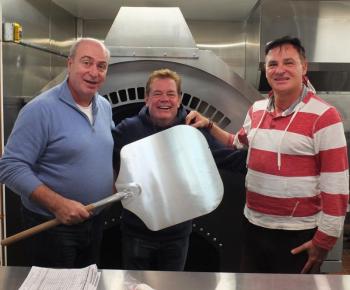 Ports Pizzeria co-owners Santi Callandri, left, and Francesco Mazzone, right, along with Ports of Italy manager Jeff Teel are ready to serve gourmet pizza to the Boothbay region. BILL PEARSON/Boothbay Register