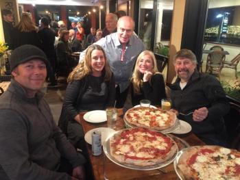 Ports Pizzeria co-owner Sante Callandri greets patrons Nov. 10, from left, Chris Fritz, Allison Evans, Cathi Bertins and Chris Bertins during the shop’s “soft”
opening. BILL PEARSON/Boothbay Register