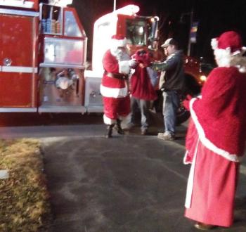 Santa and Mrs. Claus arrive at the Boothbay town office by fire truck on Saturday, Nov. 30. JANE CARPENTER/Boothbay Register