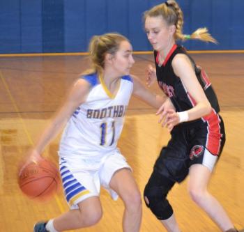 Freshman Mara Gentry dribbles against a Wiscasset defender. BILL PEARSON/Boothbay Register