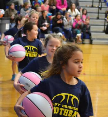 The Lady Dribblers ran around the court Jan. 4 prior to making their season debut during halftime at the Boothbay-Lisbon girls varsity game. BILL PEARSON/Boothbay Register