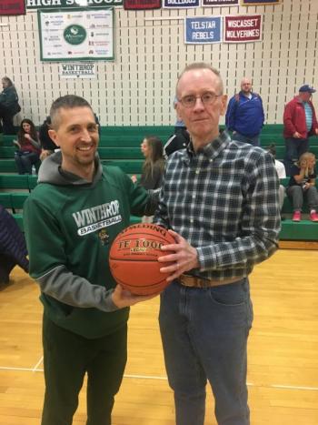 Winthrop boys basketball coach Todd McArthur congratulates BRHS boys basketball coach I.J. Pinkham on his career and that the Mountain Valley Conference will now name its Coach of the Year award the “I.J. Pinkham Boys Coach of the Year Award.” SARAH MORLEY/Boothbay Register