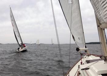 The Racing and Cruising class boats ran their races simultaneously. Pictured here is Ghost, a J/80 class racer, as to be expected is ahead at the start of Cruising Class sloop Sapphire. Courtesy of Jon Dunsford