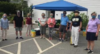 Each Friday, masked volunteers supply local residents with groceries at Boothbay Region Food Pantry at Boothbay Harbor Congregational Church. From left are Betsy Hastings, Peter Gardner, Andrea Hutchins, Bawn Clifton, Jane Lunt, Greg Barter, Fleet Davies and Barbara Fritz. BILL PEARSON/Boothbay Register