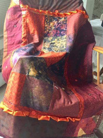 The Firecracker Quilt presented to volunteer Carole McCarthy. Dan Zajdel photo