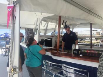 Bartender Killian Miller takes a drink order. LISA KRISTOFF/Boothbay Register