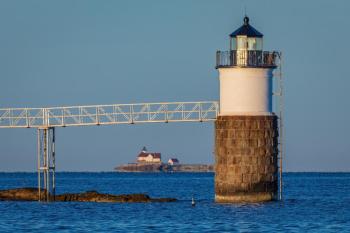 Ram Island Light in the foreground with the Cuckholds Light Station on the horizon. Mike Leonard photo
