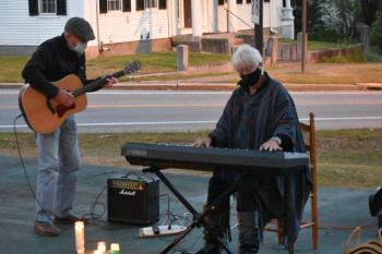 Terry Heller and Leo Egan play patriotic songs for the vigil. SARAH WHITFIELD/Wiscasset Newspaper