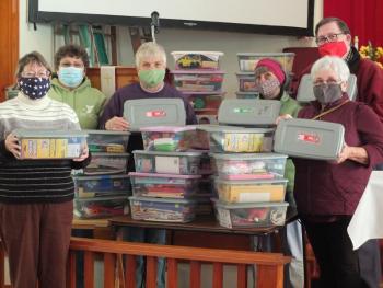 First United Methodist Church of Boothbay Harbor volunteers sent out 35 shoe box-sized containers to children all over the world this week as part of Operation Christmas Child. Pictured from left are Tammy Judkins, Doris Welch, Betty Lou Townsend, Betsy Dunton, Maggie Tourtillotte and Pastor Rich Rego. BILL PEARSON/Boothbay Register