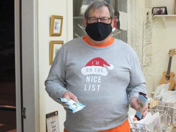 sweet bay co-owner Ken Rayle gave milk and white chocolate bars to customers and one with nuts to celebrate Early Bird 2020. BILL PEARSON/Boothbay Register