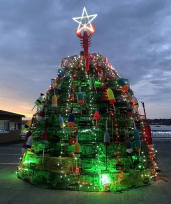 The Waterfront Park Preservation Committee’s lobster trap tree is lit as part of Boothbay Lights. KEVIN BURNHAM/Boothbay Register