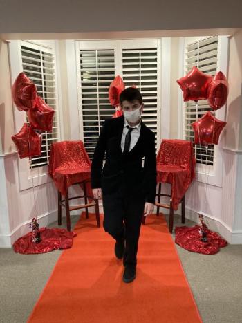 Trey Tibbetts struts down the red carpet at Water’s Edge Resort before the group enjoyed a concert by Pasek and Paul. Courtesy of Emily Mirabile