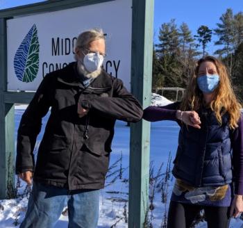 Landowner Jim Doble and Land Protection Specialist Anna Fiedler formalize Doble’s donated Conservation Easement on land in Waldoboro. Courtesy of Midcoast Conservancy