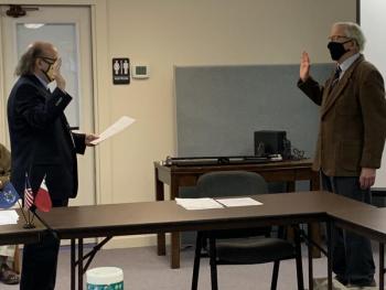 Commissioner Hamilton Meserve is sworn in for another term Jan. 5 as Dedimus Justice Matt Dunlap of Old Town officiates the ceremony. BILL PEARSON/Boothbay Register