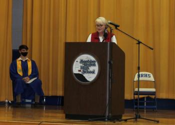 BRHS Principal Tricia Campbell speaks at the National Honor Society induction ceremony March 31. At left is member Ben Pearce. Paulette Carter photo