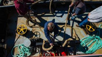 Tugboat crew member Hugh Thompson gets the tow line secured. Jim Fossett photo