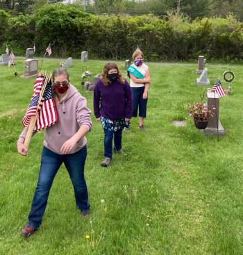 Flag placement at Evergreen Cemetery. Christopher Armstead photo