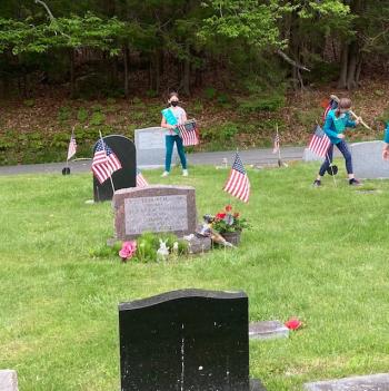 Flag placement at Evergreen Cemetery. Christopher Armstead photo