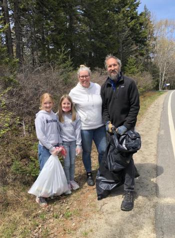 Georgia Griffith, Mabel Kaler, Amy Redfern Griffith and Shawn Griffith pick up trash along the side of Route 27 on the west side of the island. JENNY BENNETT/Boothbay Register