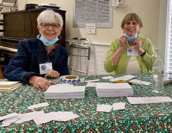 Nancy Case and Judy Boyes preparing invitations for the upcoming St. Andrews Auxiliary Volunteer Recognition in July. Courtesy of St. Andrews Auxiliary