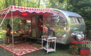 Janna Day of East Boothbay emerging from a tour inside the vintage camper, Rosie. LISA KRISTOFF/Boothbay Register