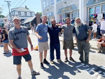 The winning team from Bristol Marine, Shipyard Shenanigans, with race sponsor and announcer Jack Herger. KEVIN BURNHAM/Boothbay Register
