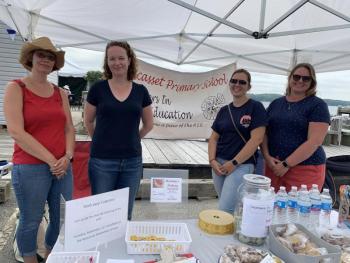 Partners in Education members, from left, Beth Bluteau of Wiscasset, Alna’s Kim Averill and Wendy Terrance and Jodi Hardwick, both of Wiscasset, run a bake sale Aug. 21 at Schoonerfest. SUSAN JOHNS/Wiscasset Newspaper