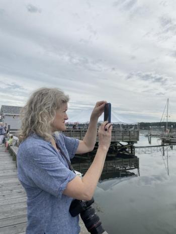 Ann Scanlan captures the schooners’ arrival. SUSAN JOHNS/Wiscasset Newspaper