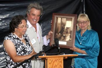 Elaine Jones and Gov. Janet Mills present artist Jamie Wyeth with a Lighthouse Preservation Award. STEVE EDWARDS/Boothbay Register