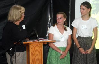 Jean McKay talks to local students and Living History actors Hannah Hills, center, and Beatrix Beatrix Recoing-Tallen, in costume. STEVE EDWARDS/Boothbay Register